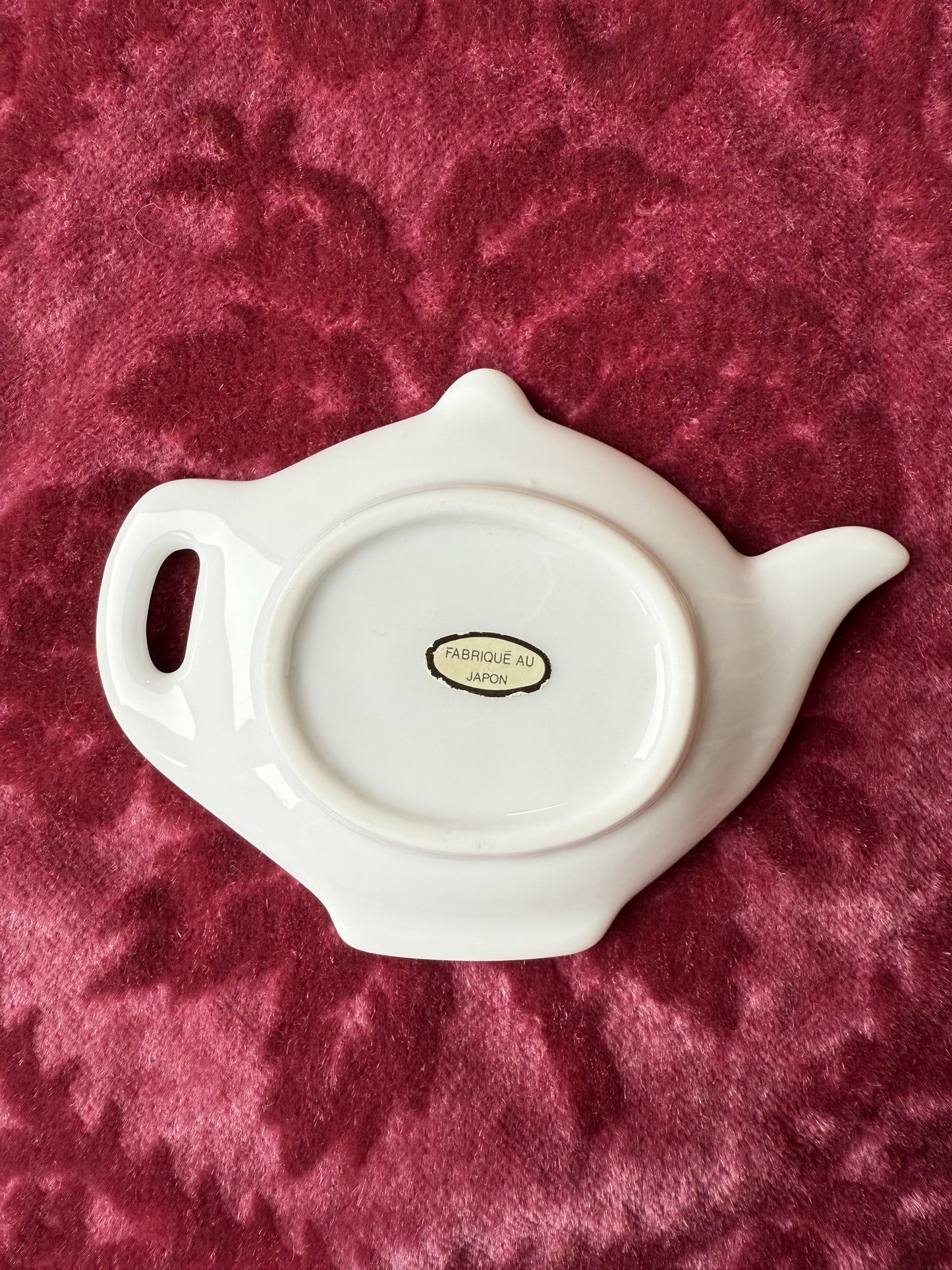 Repose sachet de thé en forme de théière