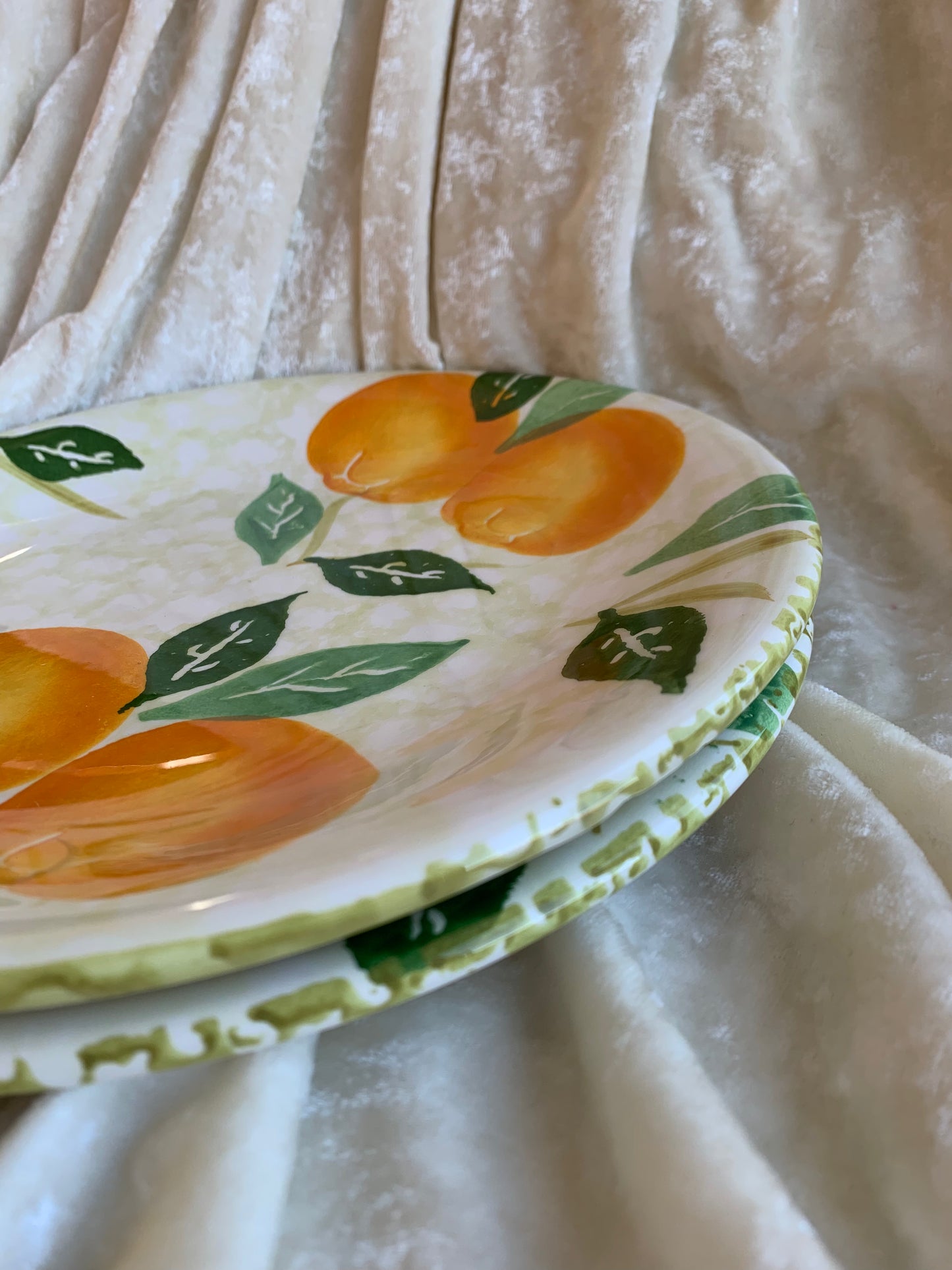 Deux assiettes plates motifs oranges Made in Italy