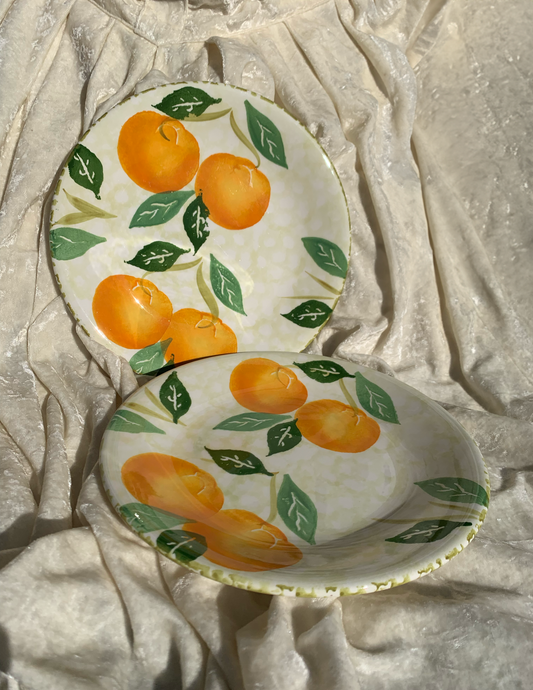 Deux assiettes plates motifs oranges Made in Italy